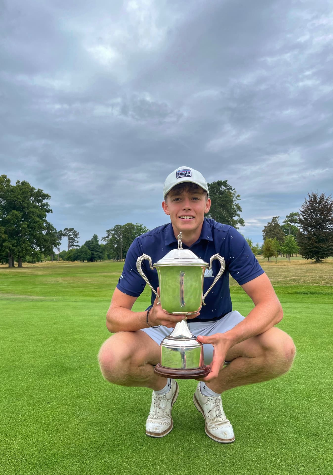 Thomas Taylor-Cross holding a silver tournament trophy